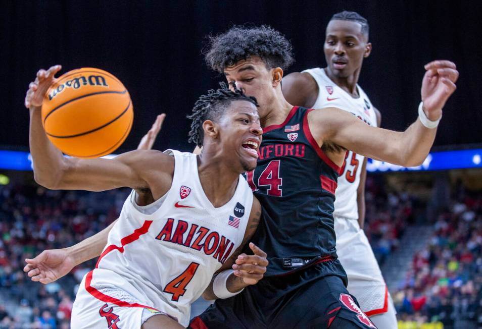 Arizona Wildcats guard Dalen Terry (4) drives inside of Stanford Cardinal forward Spencer Jones ...