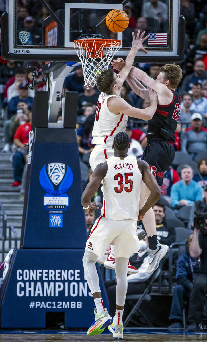 Arizona Wildcats forward Azuolas Tubelis (10) fouls Stanford Cardinal forward James Keefe (22) ...