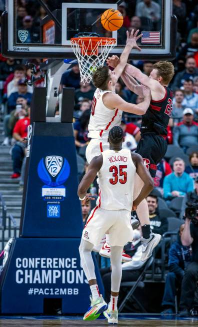 Arizona Wildcats forward Azuolas Tubelis (10) fouls Stanford Cardinal forward James Keefe (22) ...