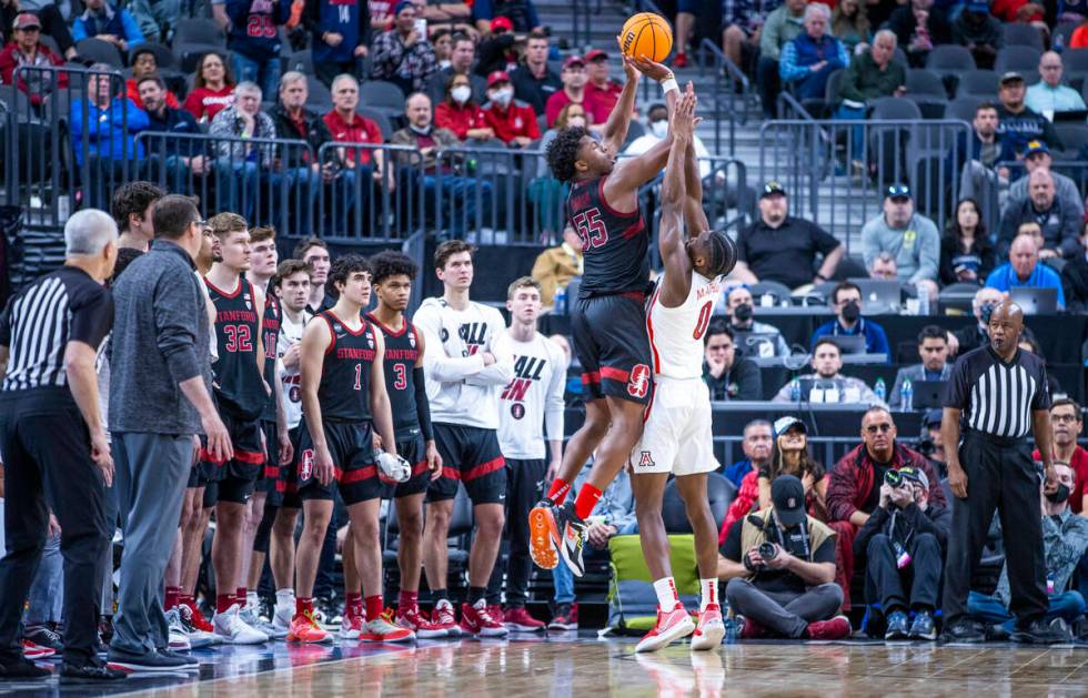 The team watches as Stanford Cardinal forward Harrison Ingram (55) makes a three-point basket o ...