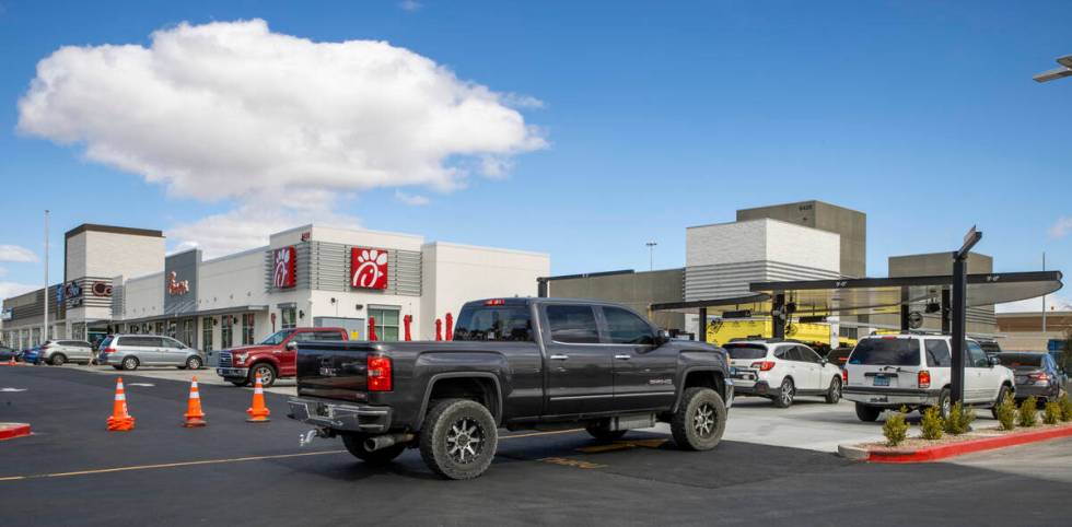 Vehicles move along the drive-thru as the new Chick-Fil-A opens complete with a ribbon cutting ...