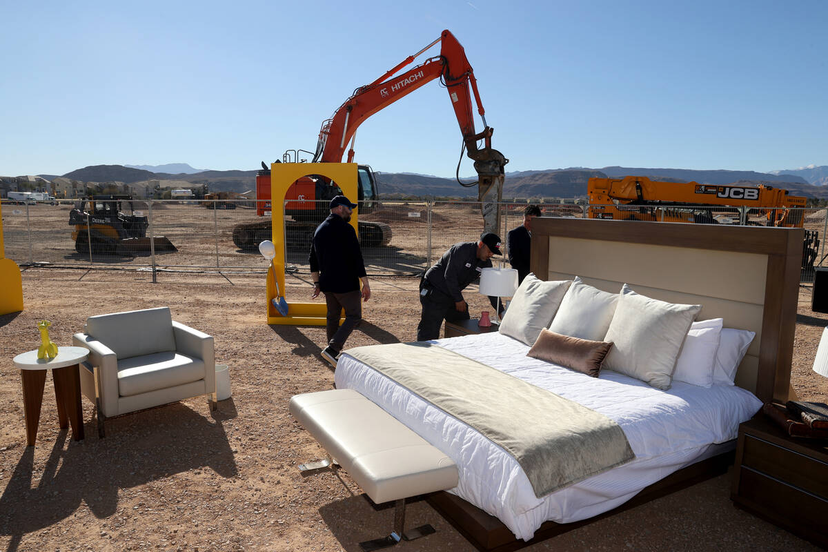 Workers set up a hotel room during a media event at the construction site for Station Casinos&# ...