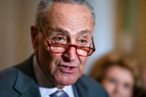 Senate Majority Leader Chuck Schumer, D-N.Y., speaks to reporters about the Russian invasion of ...