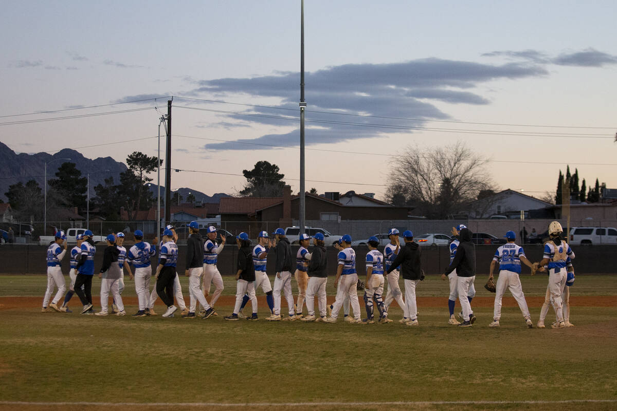 Basic celebrates a win against Centennial in a high school baseball game at Basic High School o ...