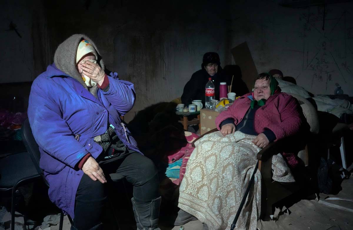 Elderly residents hide in a basement for shelter, with no electricity, water or food in the cen ...