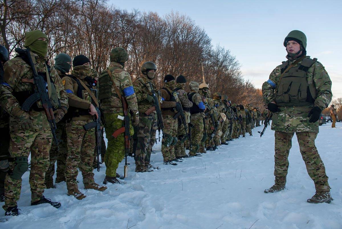 Ukrainian servicemen attend a training session outside Kharkiv, Ukraine, Friday, March 11, 2022 ...