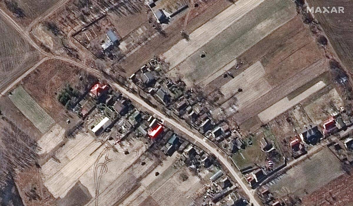 This satellite image provided by Maxar Technologies shows a military deployment of armored vehi ...