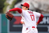 Los Angeles Angels starting pitcher Shohei Ohtani throws to the plate during the first inning o ...
