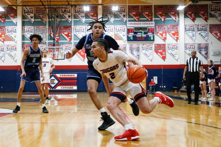Coronado's Richard Isaacs (2) drives the ball against Canyon Springs' Jalen Foy during the firs ...