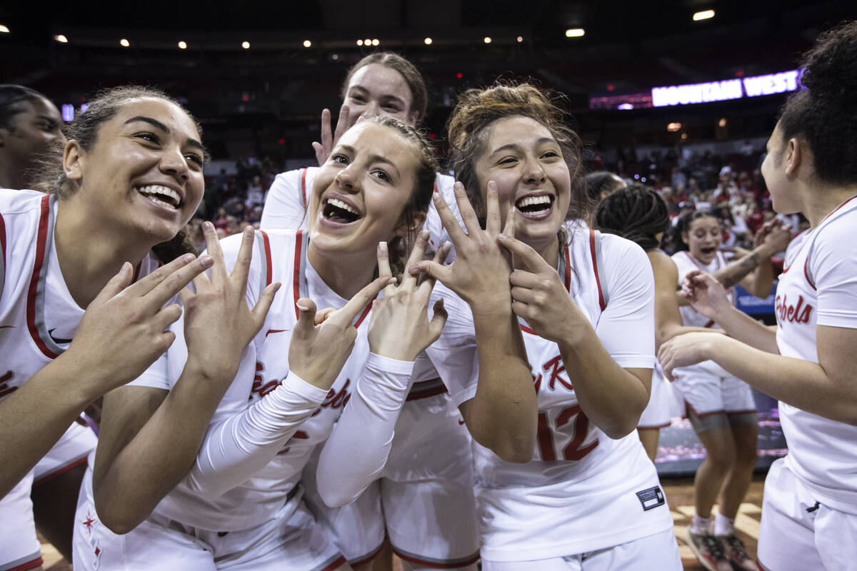 UNLV Lady Rebels guards Kenadee Winfrey, second from left, and Alyssa Durazo-Frescas (12) celeb ...