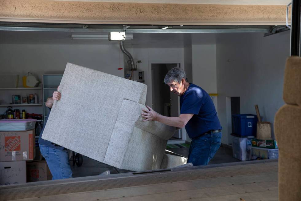 Tom Steyer loads the couch that his 16-year-old son, Louis, died on into a moving truck on Feb. ...