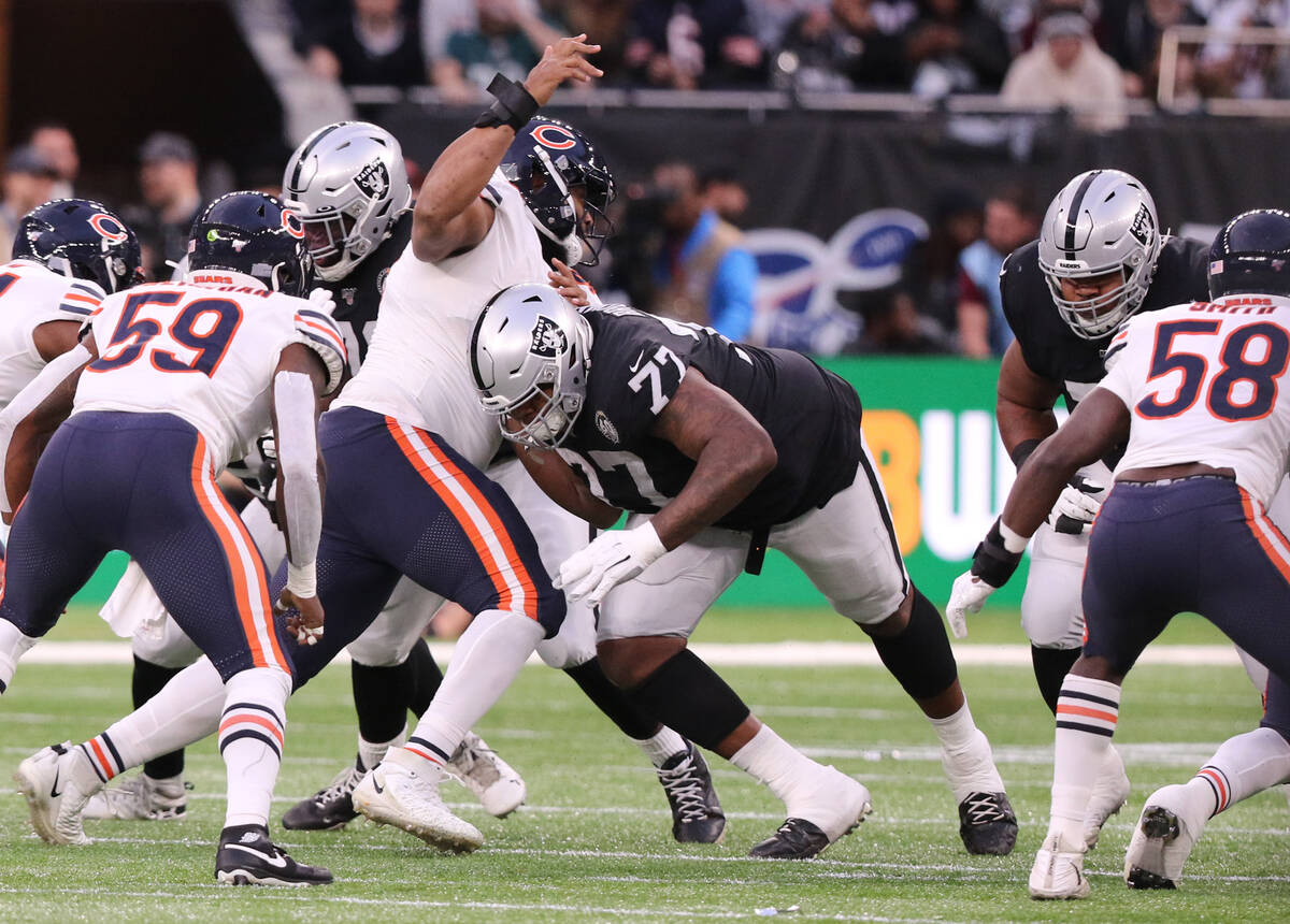 Oakland Raiders offensive tackle Trent Brown (77) blocks Chicago Bears defensive tackle Akiem H ...