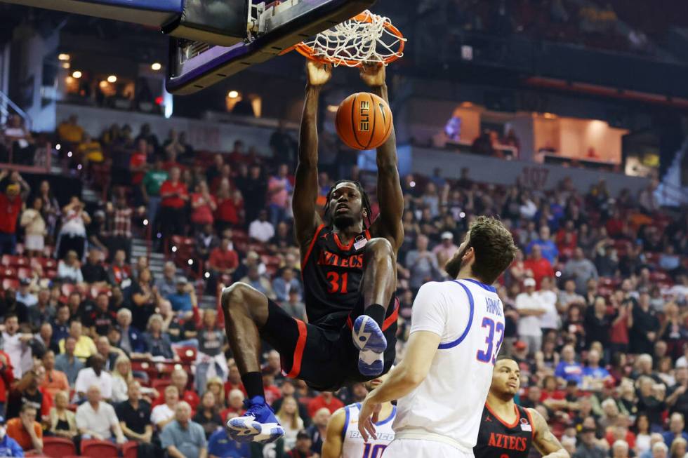 San Diego State Aztecs forward Nathan Mensah (31) dunks the ball as Boise State Broncos forward ...