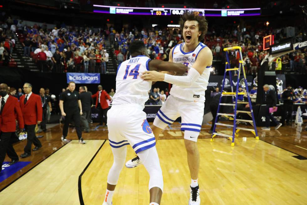 Boise State Broncos guard Emmanuel Akot (14) and forward Tyson Degenhart (2) celebrate after de ...