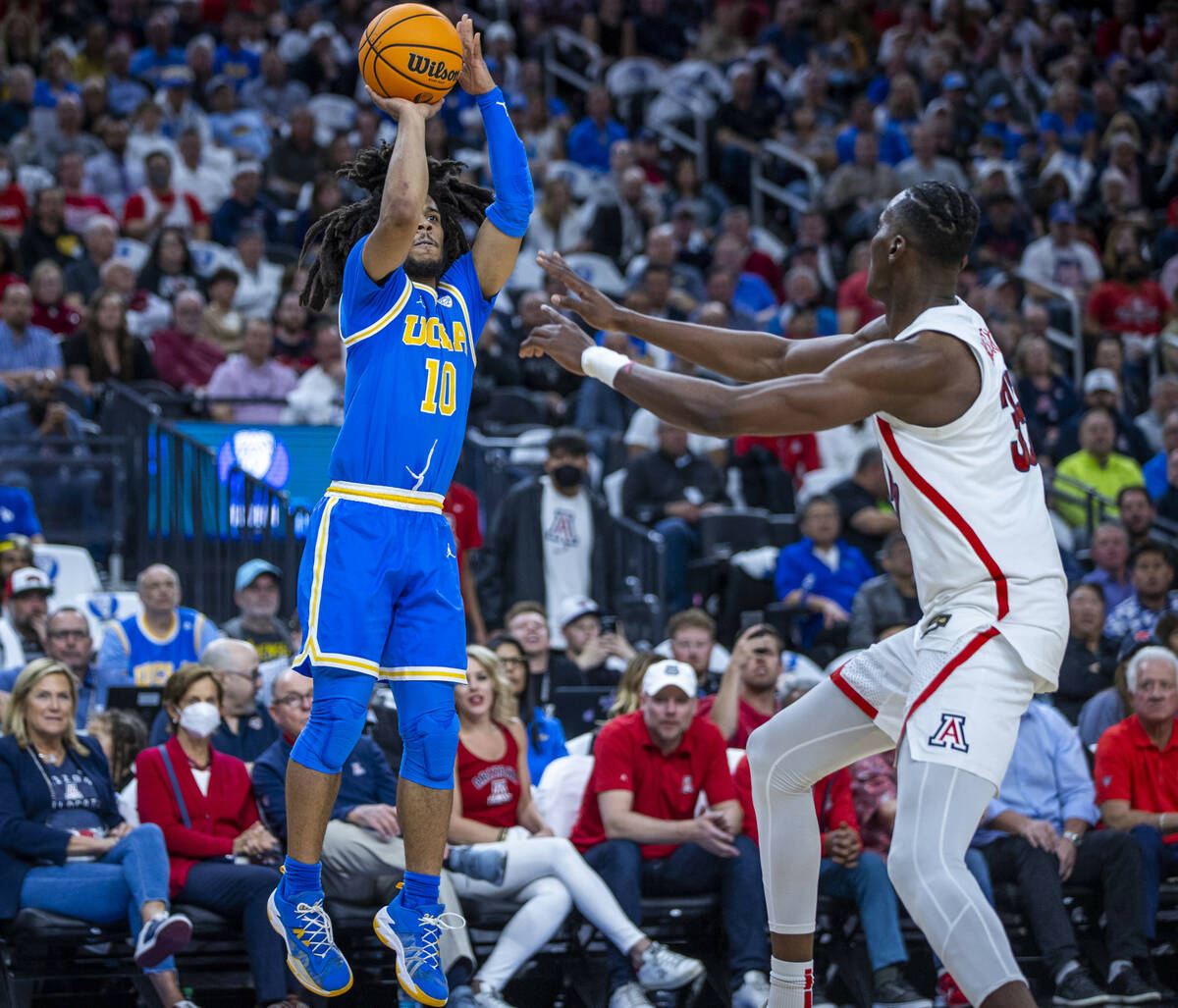 UCLA Bruins guard Tyger Campbell (10) elevates for a three-point basket over Arizona Wildcats c ...