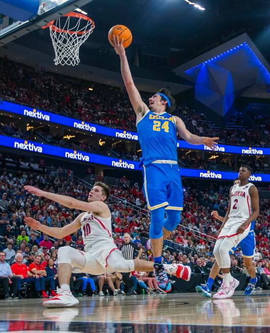 UCLA Bruins guard Jaime Jaquez Jr. (24) readies to score after colliding with Arizona Wildcats ...