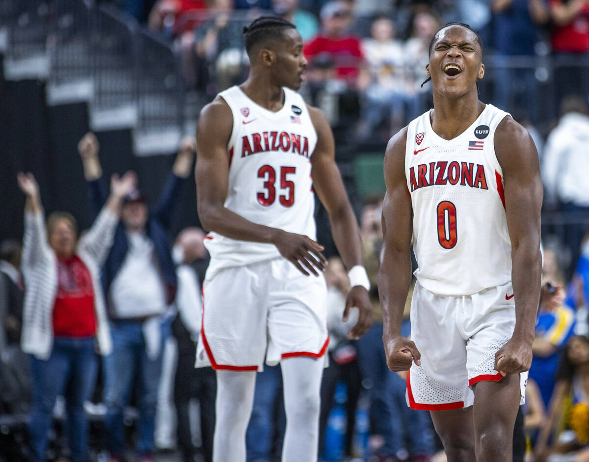 Arizona Wildcats guard Bennedict Mathurin (0) and Arizona Wildcats center Christian Koloko (35) ...