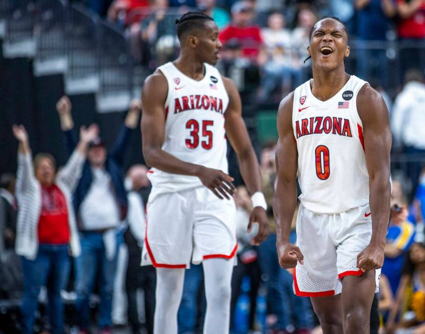 Arizona Wildcats guard Bennedict Mathurin (0) and Arizona Wildcats center Christian Koloko (35) ...