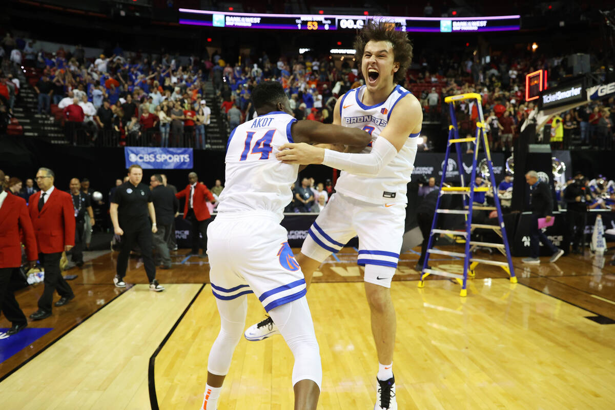 Boise State Broncos guard Emmanuel Akot (14) and forward Tyson Degenhart (2) celebrate after de ...