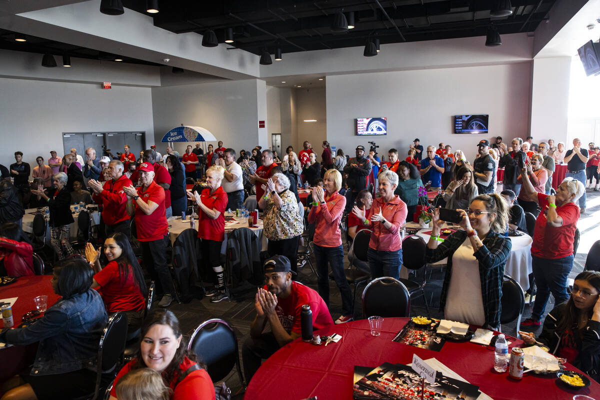 Attendees give a standing ovation to the UNLV Lady Rebels before the NCAA selection show at the ...