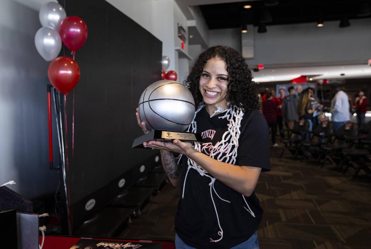 UNLV Lady Rebels guard Essence Booker holds her MVP trophy after watching the NCAA selection sh ...