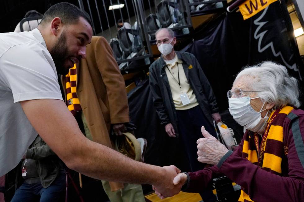 Sister Jean, chaplain for the Loyola Chicago men's basketball team, right, celebrates as she ta ...