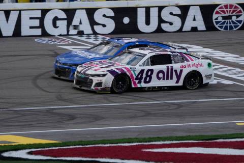 Alex Bowman (48) races beside Kyle Larson (5) during a NASCAR Cup Series auto race Sunday, Marc ...