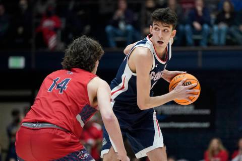 Gonzaga center Chet Holmgren, right, is defended by Saint Mary's forward Kyle Bowen during the ...