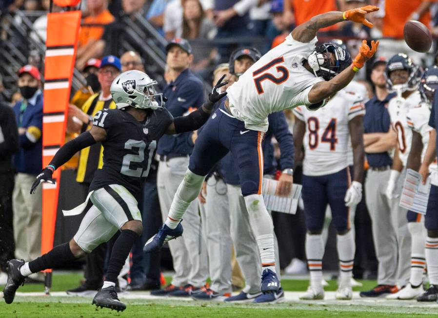 Chicago Bears wide receiver Allen Robinson (12) tries to bring in a catch over Raiders cornerba ...
