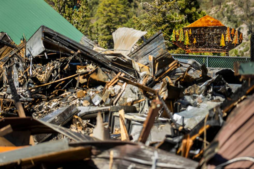 The burned remains of the Mount Charleston Lodge with iconic carved sign Wednesday, Sept. 22, 2 ...