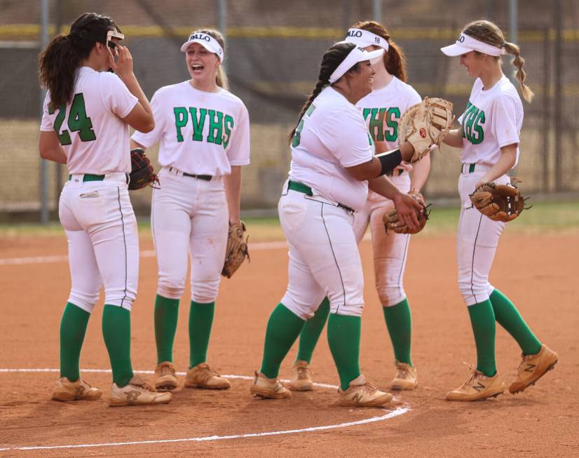 Palo Verde players meet at the mound during a girls high school softball game against Green Val ...