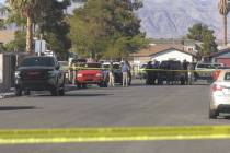Police investigate a shooting at the 1400 block of Newport Street in Las Vegas on Monday, March ...