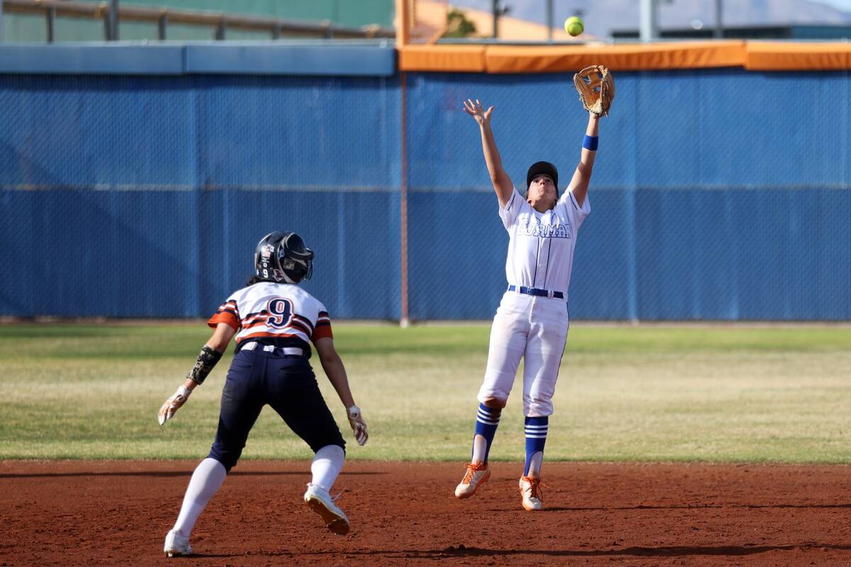 Bishop Gorman’s Brooke Ventrelle (23) reaches short of the ball as Legacy’s Madison Ruiz ( ...