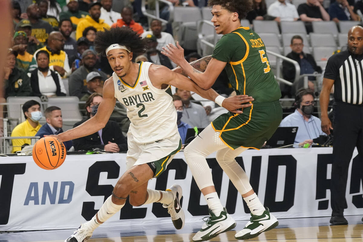 Baylor guard Kendall Brown (2) drives against Norfolk State guard Tyrese Jenkins (5) during the ...
