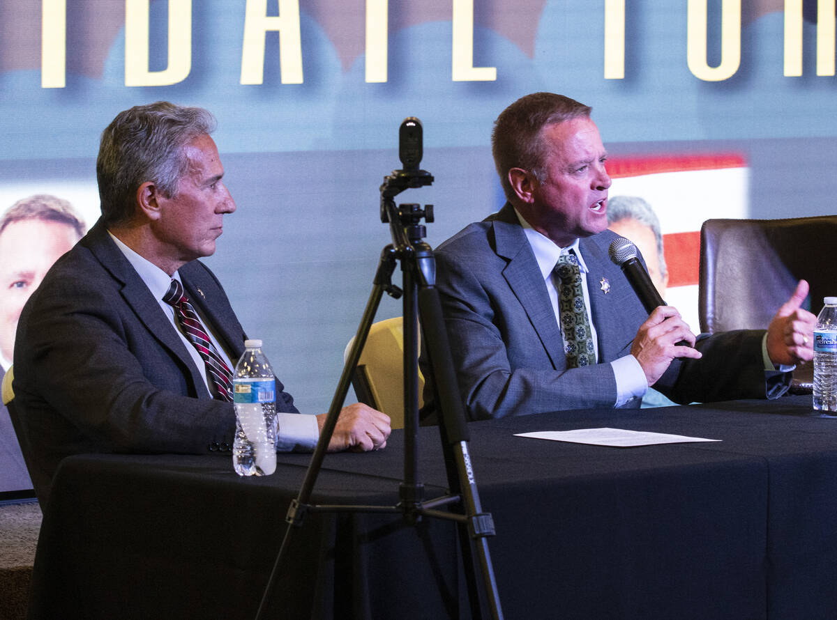 Former Undersheriff and the Clark County Sheriff candidate Kevin McMahill, right, speaks as can ...