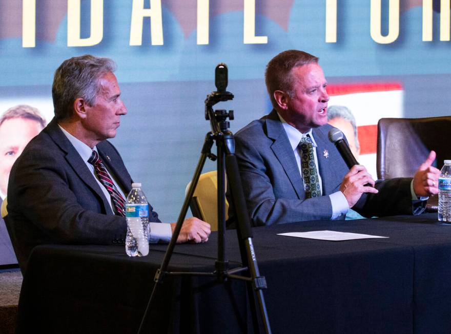 Former Undersheriff and the Clark County Sheriff candidate Kevin McMahill, right, speaks as can ...