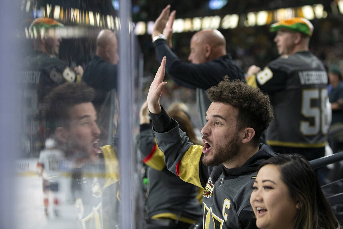 Hunter Marciano and Cindy Yang cheer after Golden Knights right wing Evgenii Dadonov (63) score ...