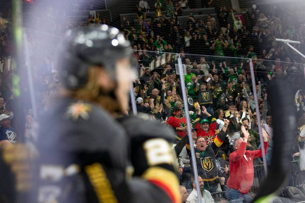 Golden Knights fans cheer in the background as Golden Knights center William Karlsson (71) cele ...