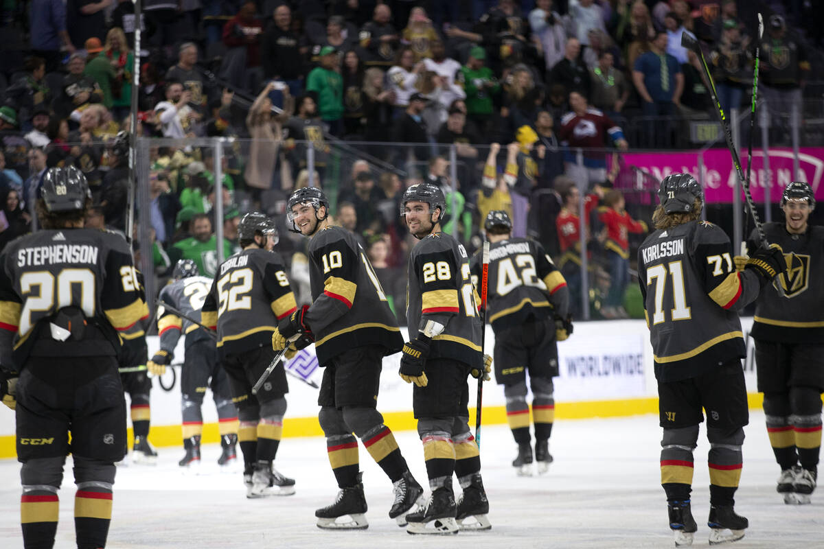 Golden Knights players including center Nicolas Roy (10) and left wing William Carrier (28) cel ...