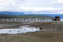 A pier and dock are seen at Lake Tahoe's receding shoreline in October 2021 at Tahoe City, Cali ...