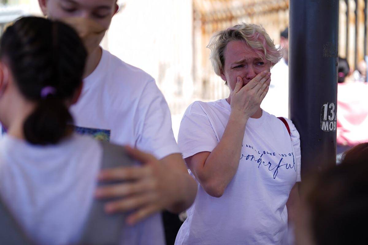 Irina Zolkina, who is seeking asylum in the United States, cries as she recalls her trip from R ...