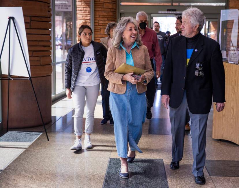 Rep. Dina Titus, D-Nev., walks with former Las Vegas City Councilman Bob Coffin as she readies ...