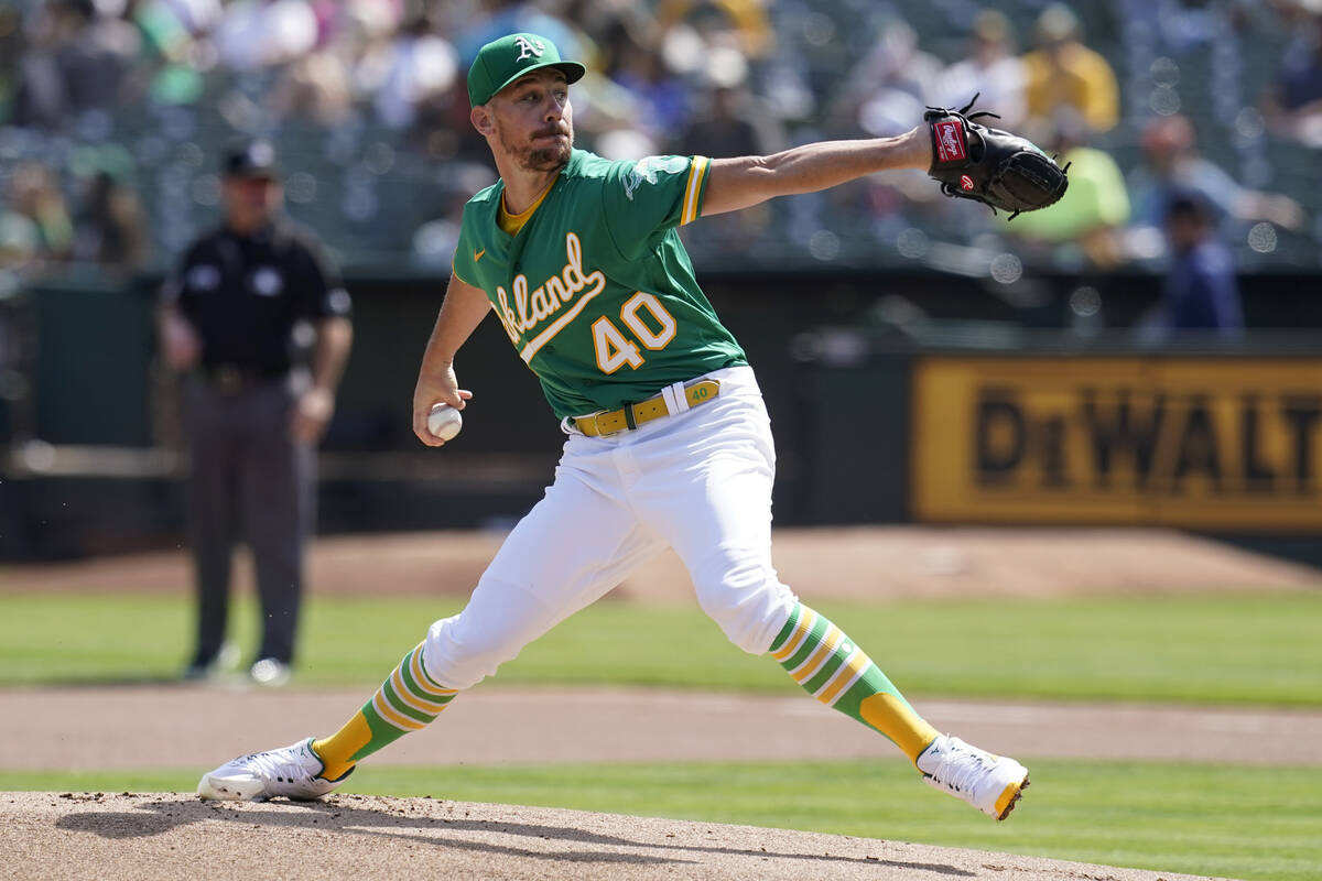 Oakland Athletics pitcher Chris Bassitt winds up during the team's game against the Seattle Mar ...