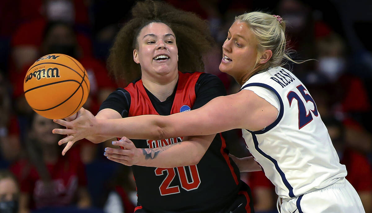 Arizona forward Cate Reese (25) tries to steal the ball from UNLV forward Khayla Rooks (20) dur ...