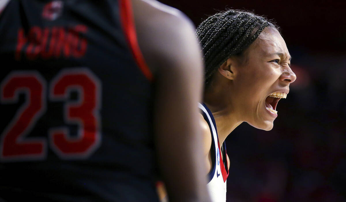 Arizona forward Sam Thomas yells after forcing a turnover on an inbound pass by UNLV center Des ...