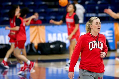 UNLV head coach Lindy La Rocque talks with her team while watching them warm up with layups dur ...