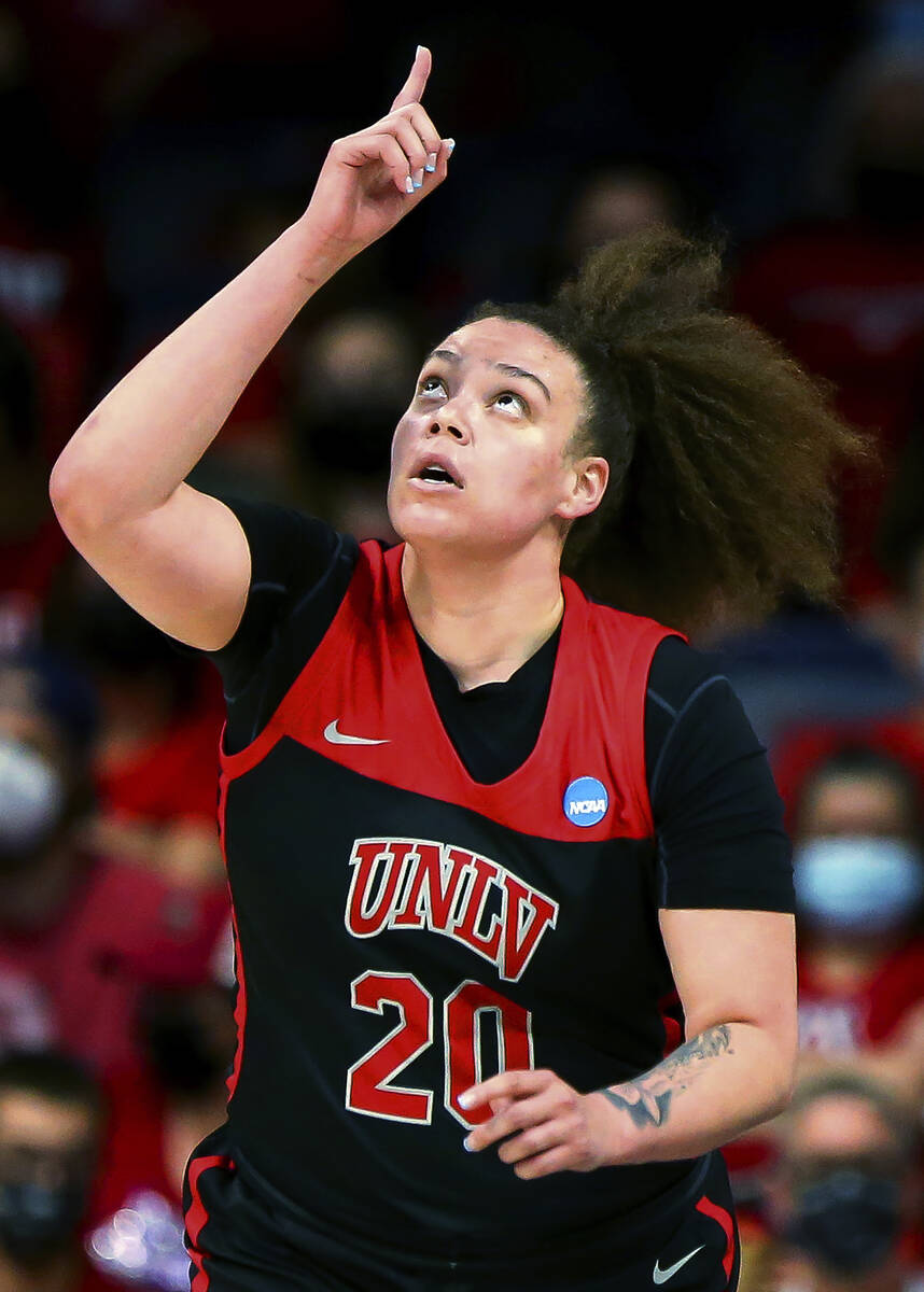 UNLV forward Khayla Rooks points upward after hitting a shot against Arizona during a first-rou ...