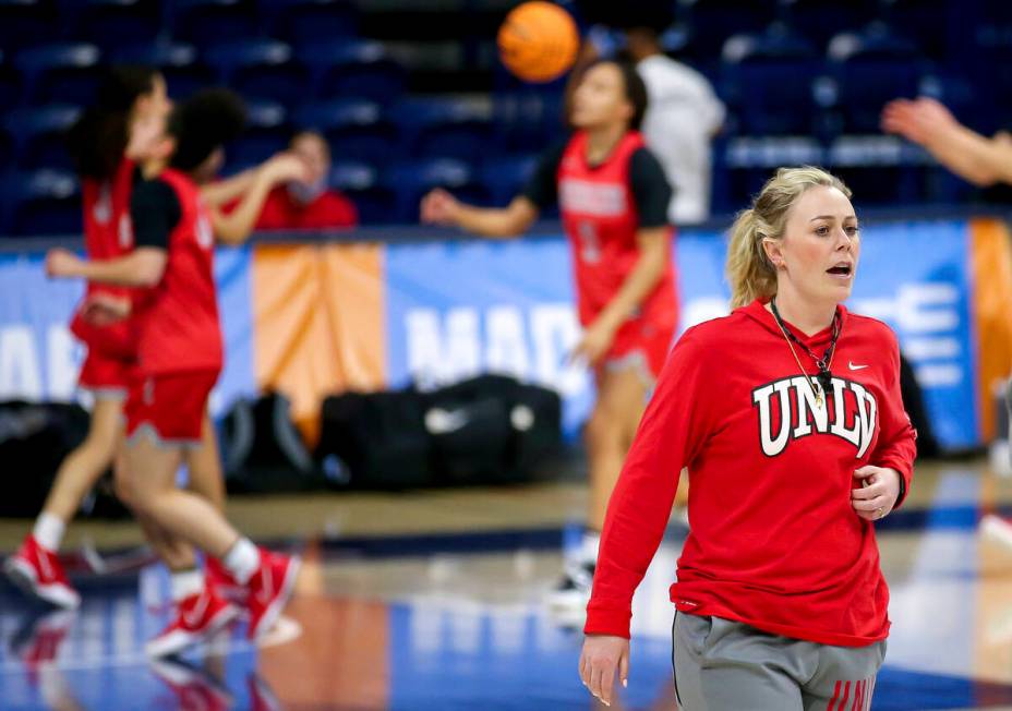 UNLV head coach Lindy La Rocque talks with her team while watching them warm up with layups dur ...