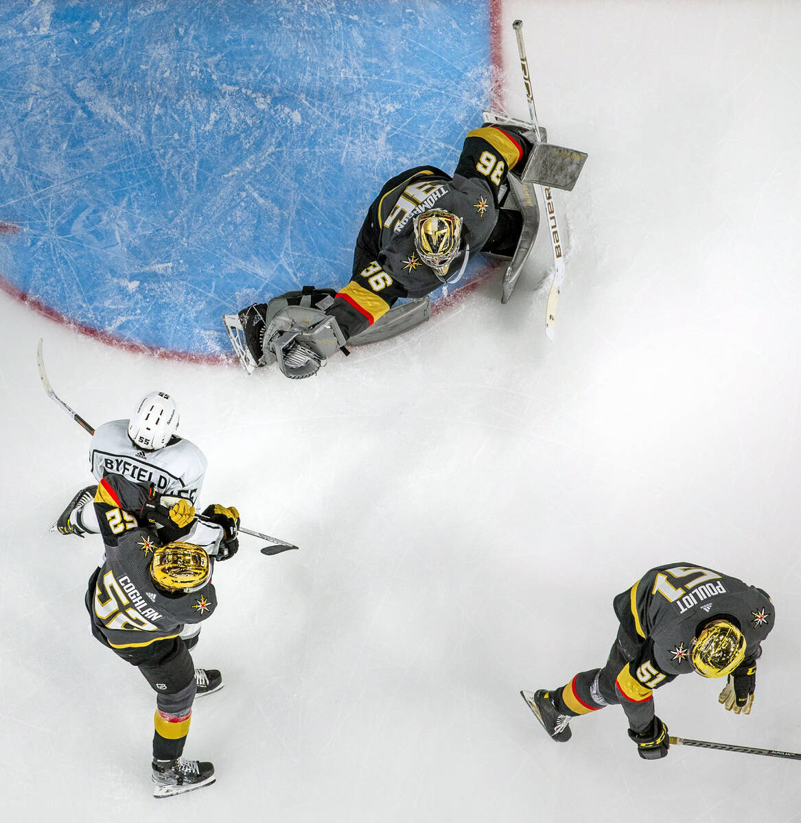 Golden Knights goaltender Logan Thompson (36) extends for a save over Los Angeles Kings center ...