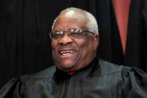 FILE - In this Nov. 30, 2018, photo, Supreme Court Associate Justice Clarence Thomas sits for a ...
